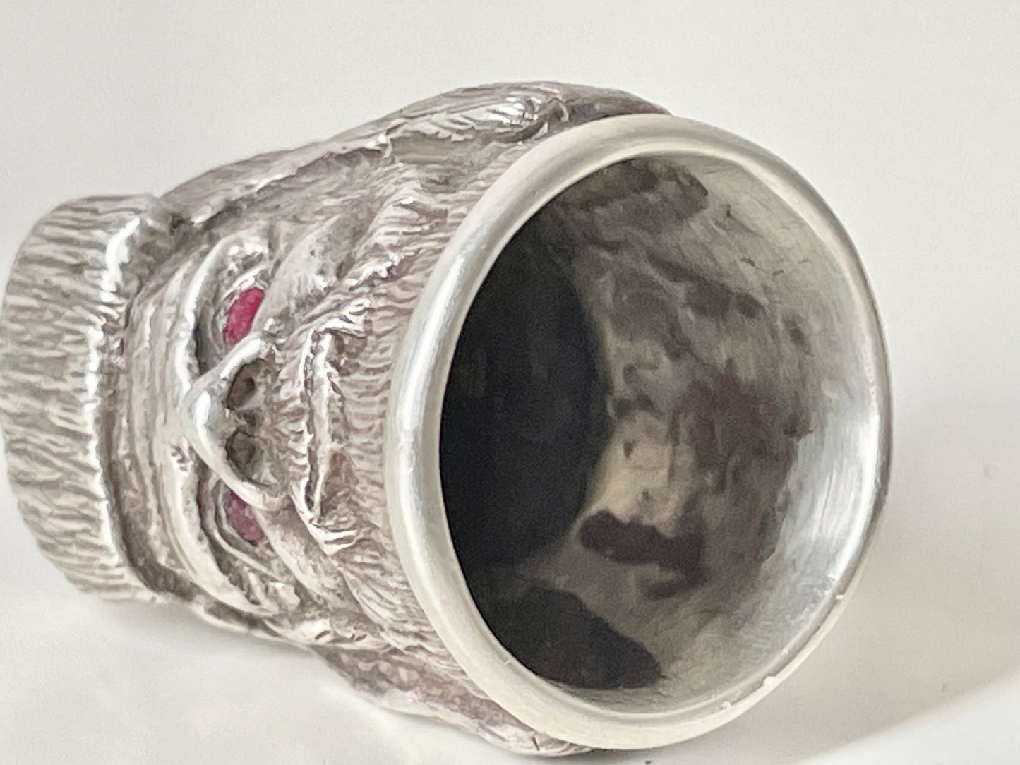 Ruby-eyed silver peasant head sewing thimble wearing Faberge mark