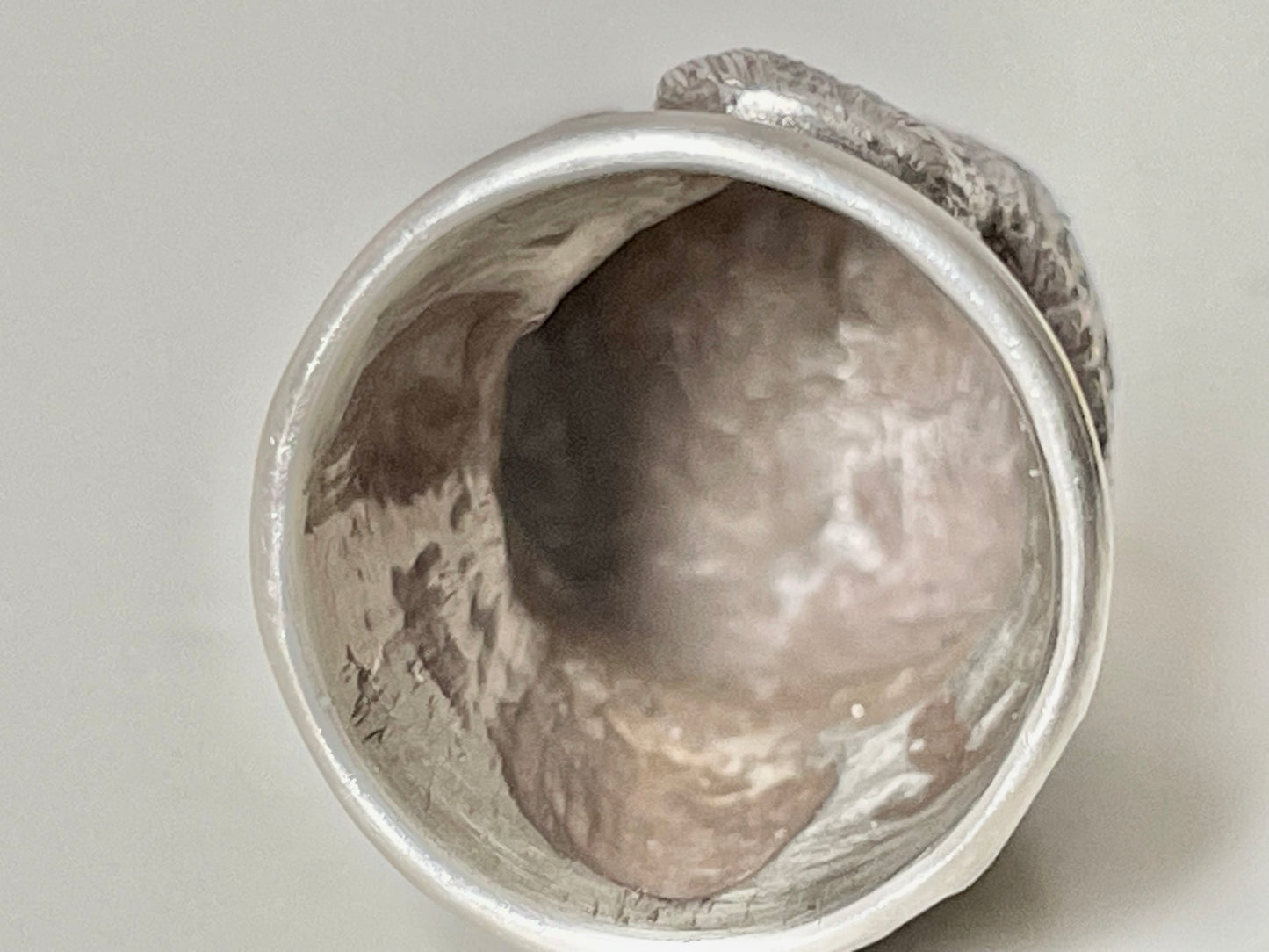 Ruby-eyed silver peasant head sewing thimble wearing Faberge mark