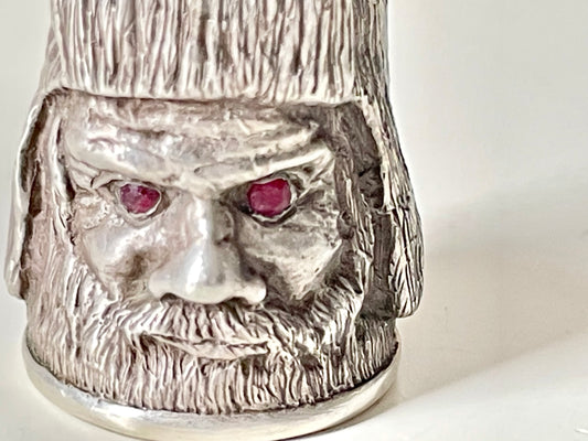 Ruby-eyed silver peasant head sewing thimble wearing Faberge mark