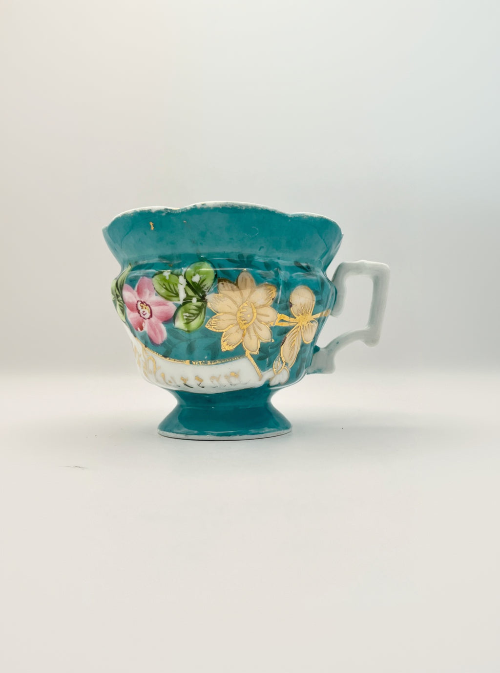 Hand-painted porcelain tea cup produced by Kuznetsov factory