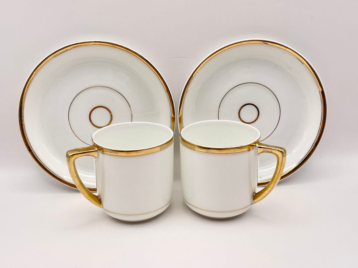 A Pair of White and Golg Antique Kuznetsov Coffee Duos from Imperial Russian Era c. 1900–1917