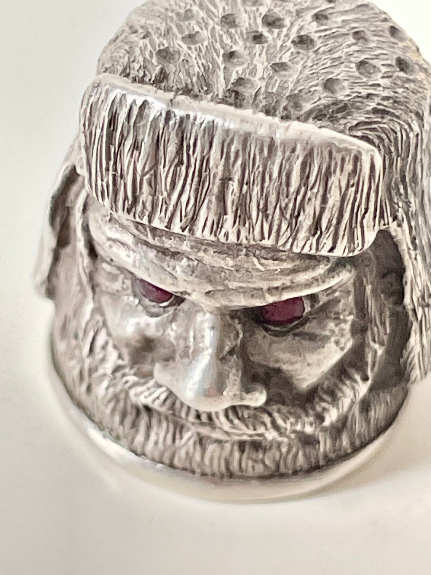 Ruby-eyed silver peasant head sewing thimble wearing Faberge mark