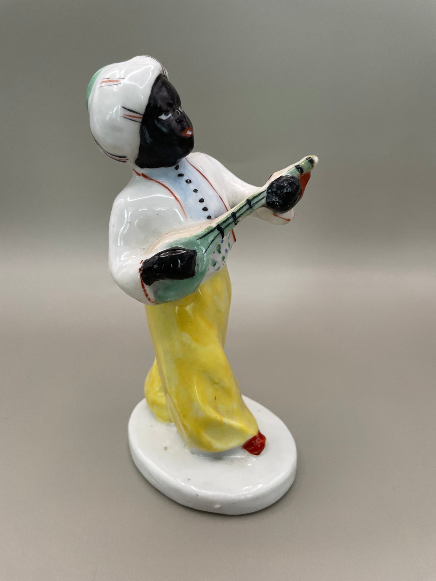 Arabian boy with banjo figurine by Gorodnitsa