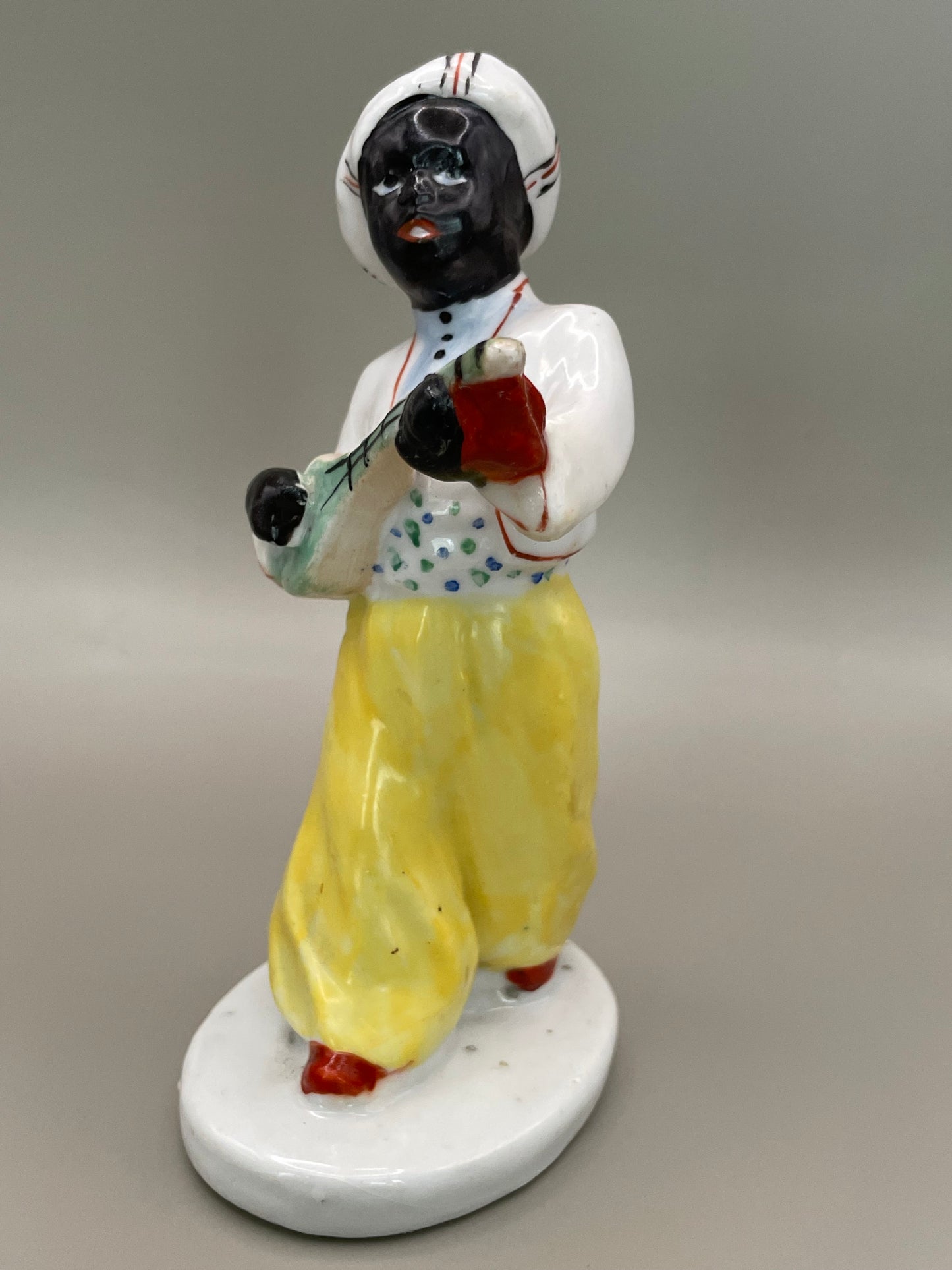 Arabian boy with banjo figurine by Gorodnitsa