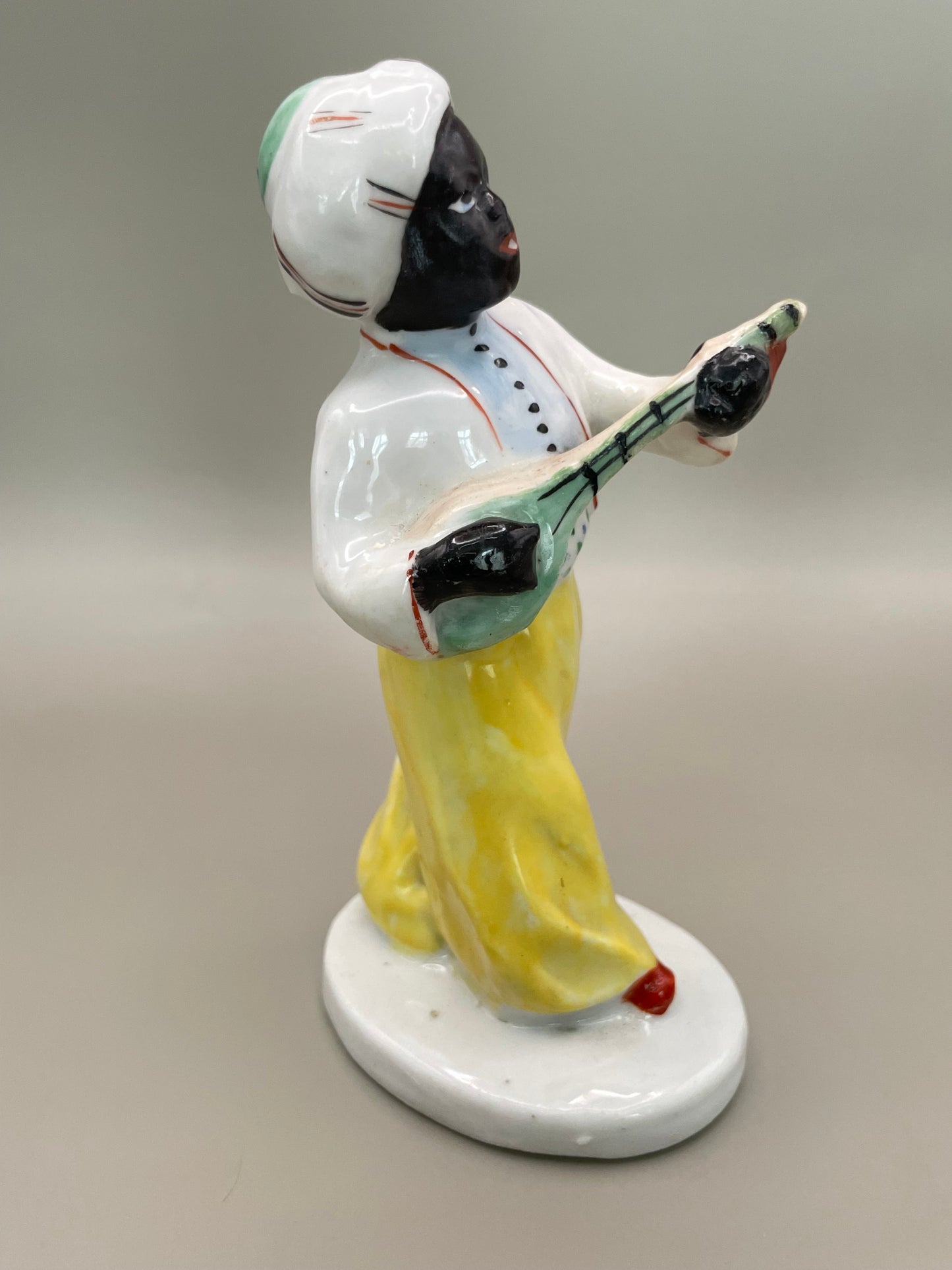 Arabian boy with banjo figurine by Gorodnitsa