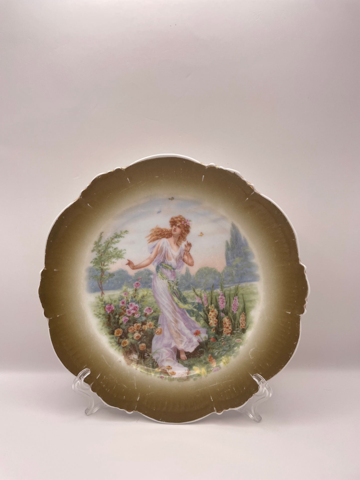 Kuznetsov’s plate depicting lady with butterflies