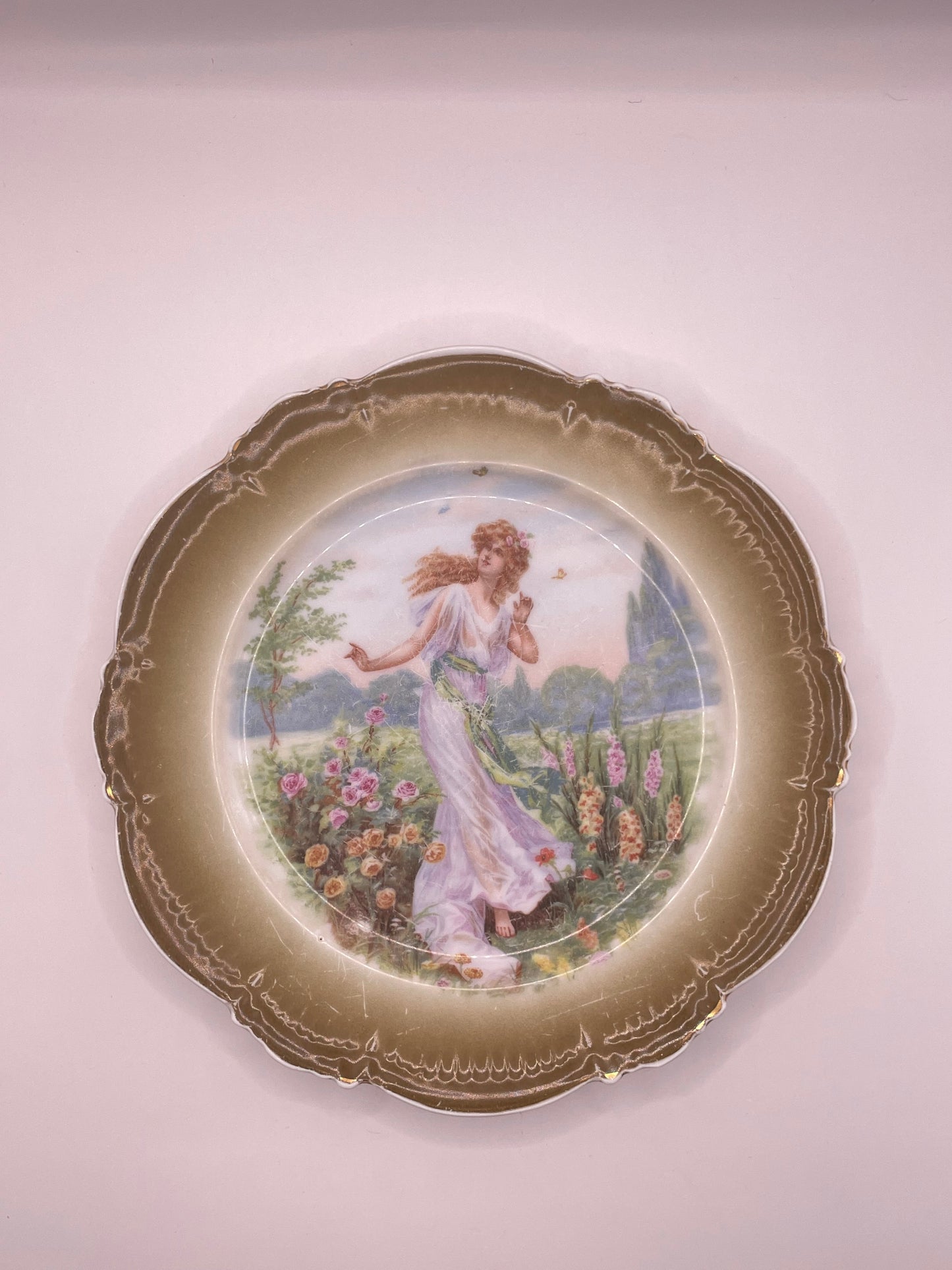 Kuznetsov’s plate depicting lady with butterflies