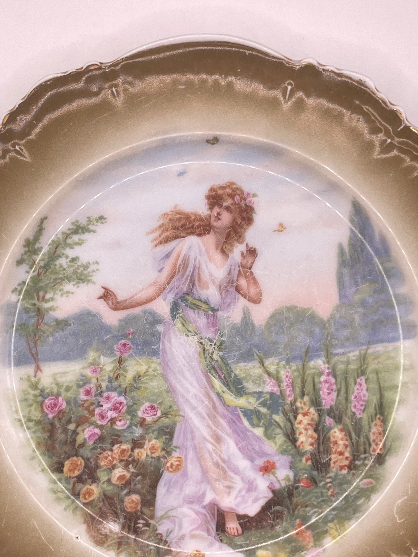 Kuznetsov’s plate depicting lady with butterflies