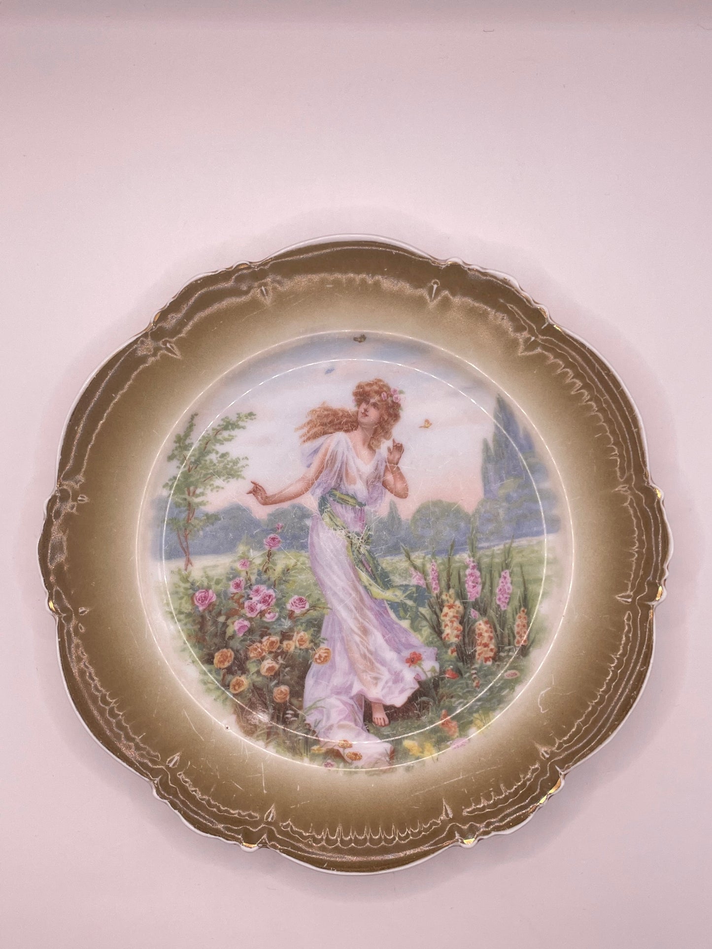 Kuznetsov’s plate depicting lady with butterflies