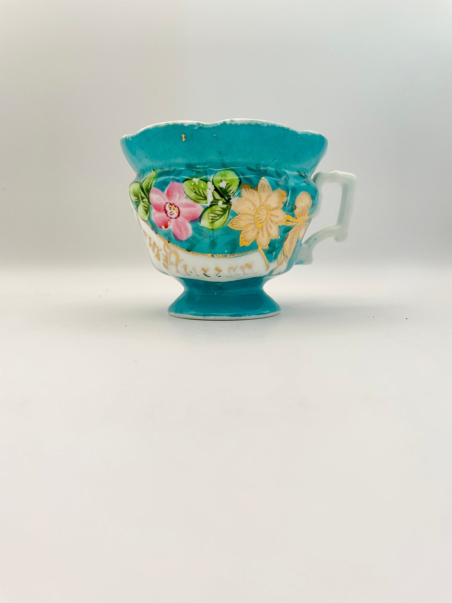 Hand-painted porcelain tea cup produced by Kuznetsov factory