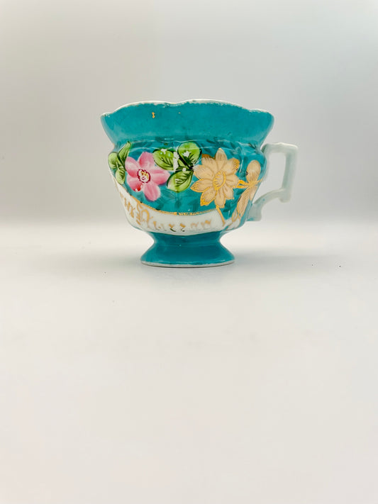 Hand-painted porcelain tea cup produced by Kuznetsov factory