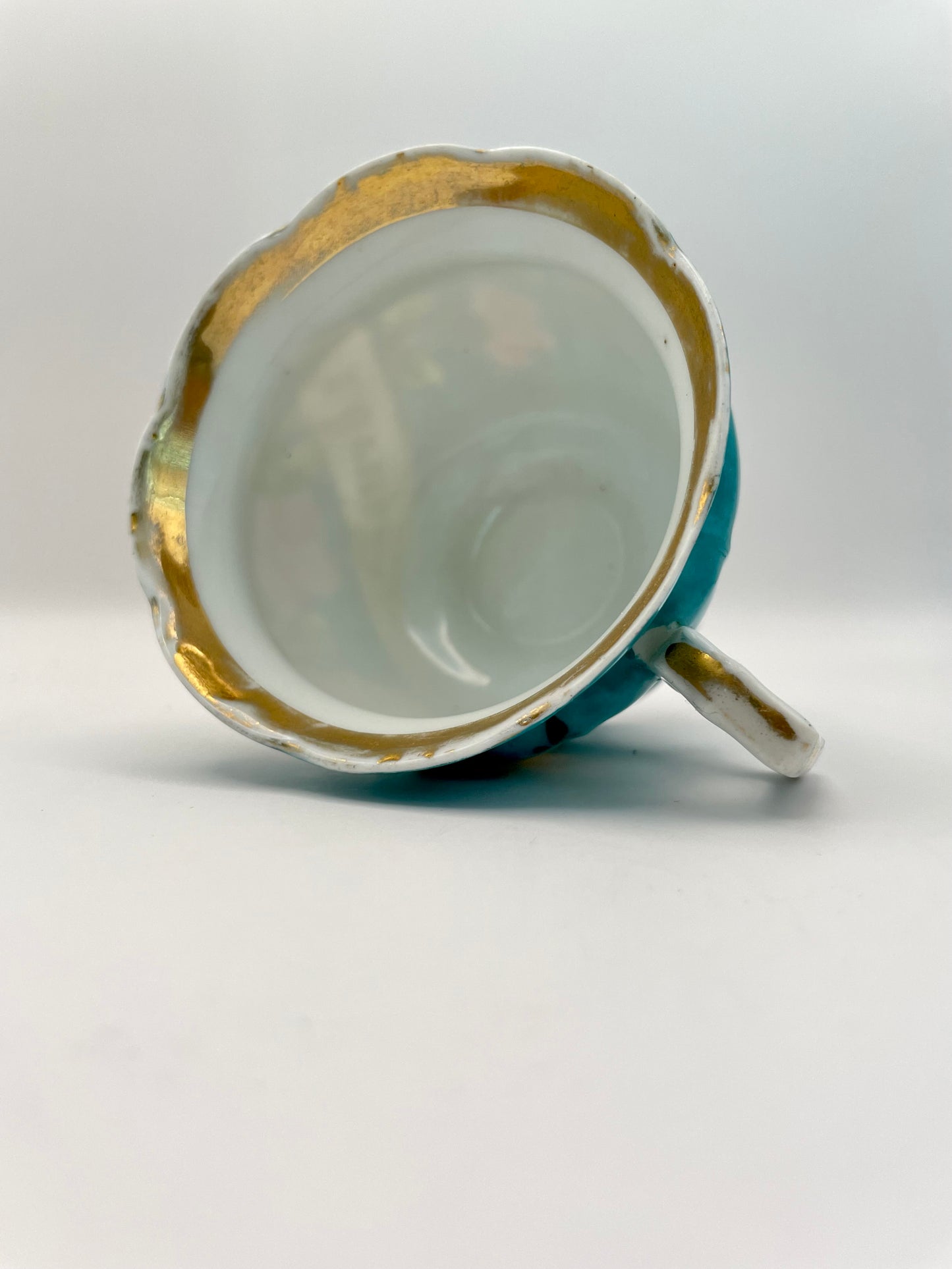 Hand-painted porcelain tea cup produced by Kuznetsov factory