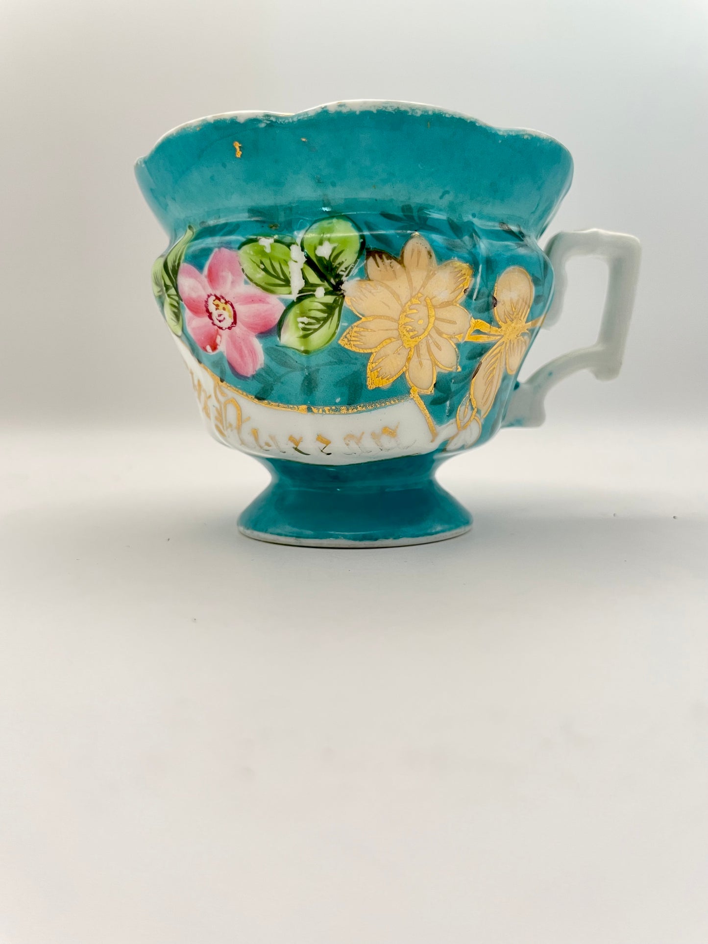 Hand-painted porcelain tea cup produced by Kuznetsov factory
