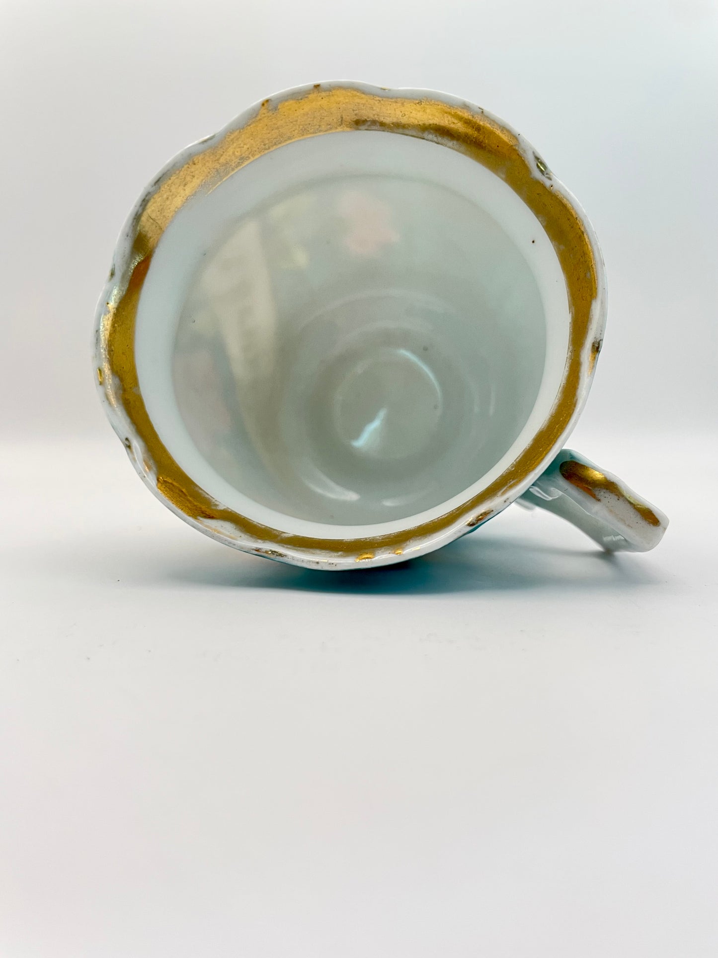 Hand-painted porcelain tea cup produced by Kuznetsov factory