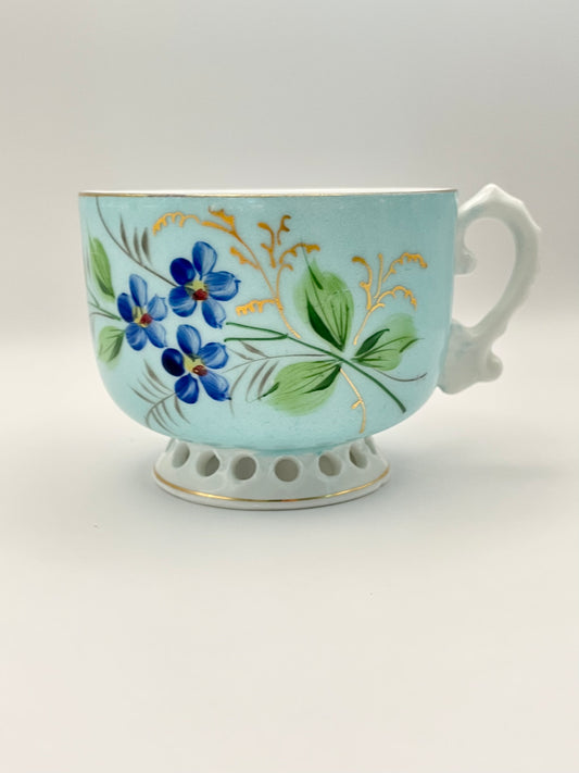 Hand-painted lace-footed porcelain tea cup produced by Kuznetsov