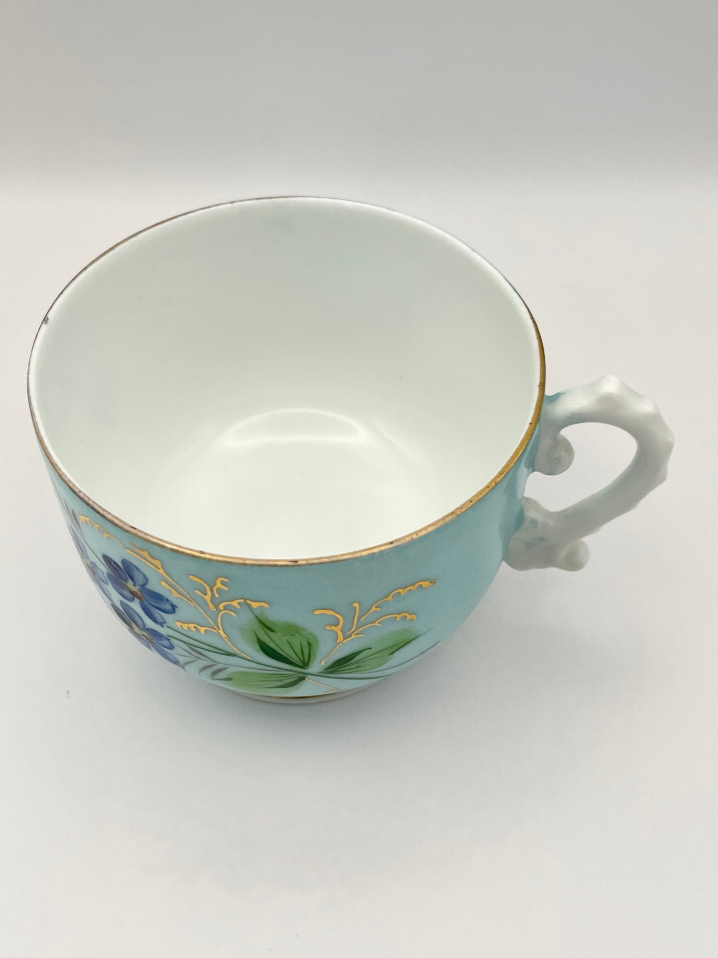 Hand-painted lace-footed porcelain tea cup produced by Kuznetsov
