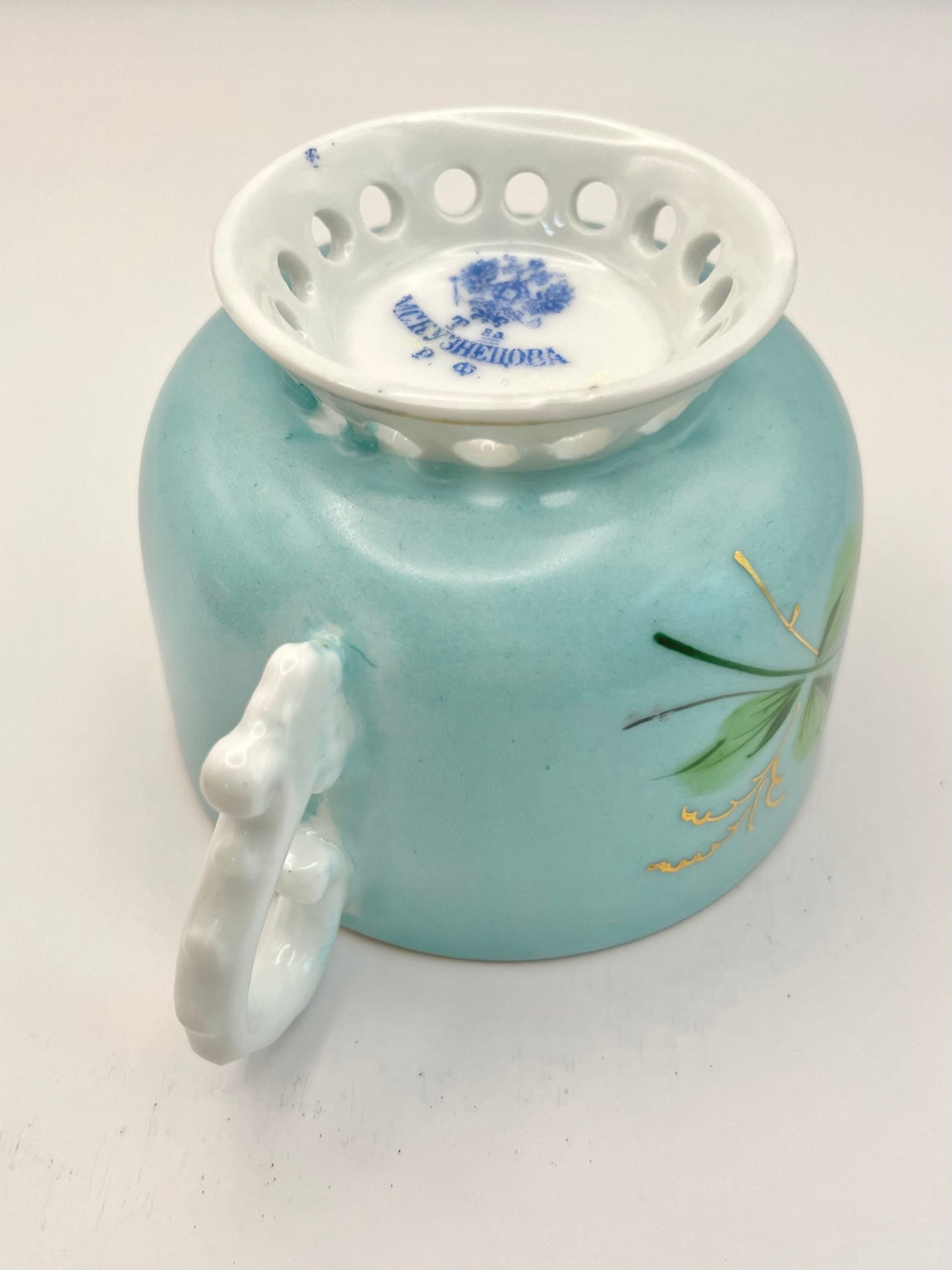 Hand-painted lace-footed porcelain tea cup produced by Kuznetsov