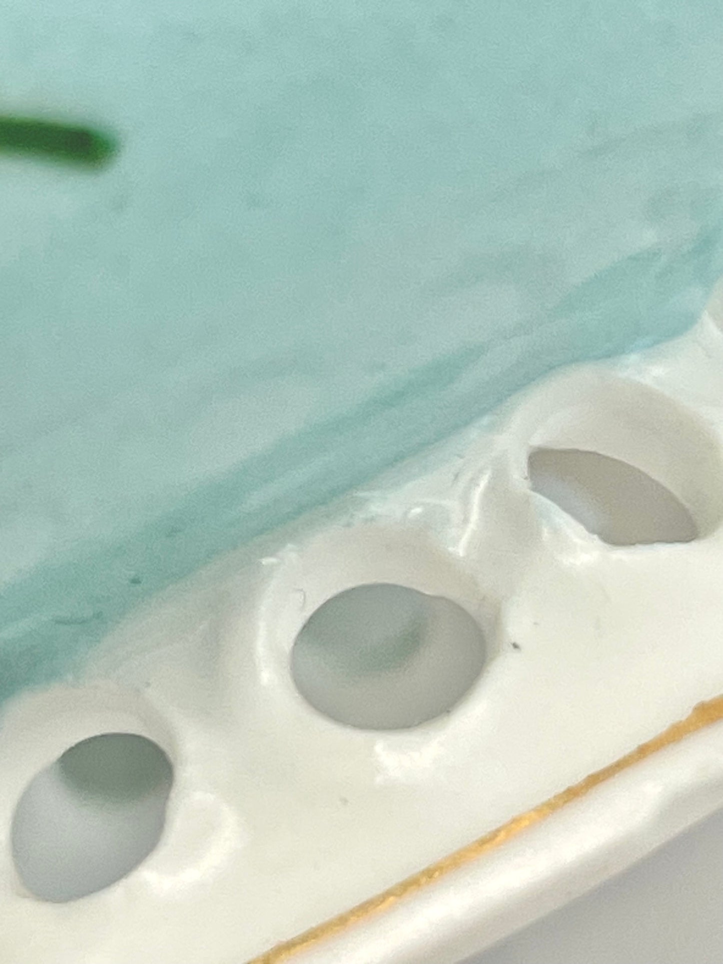 Hand-painted lace-footed porcelain tea cup produced by Kuznetsov