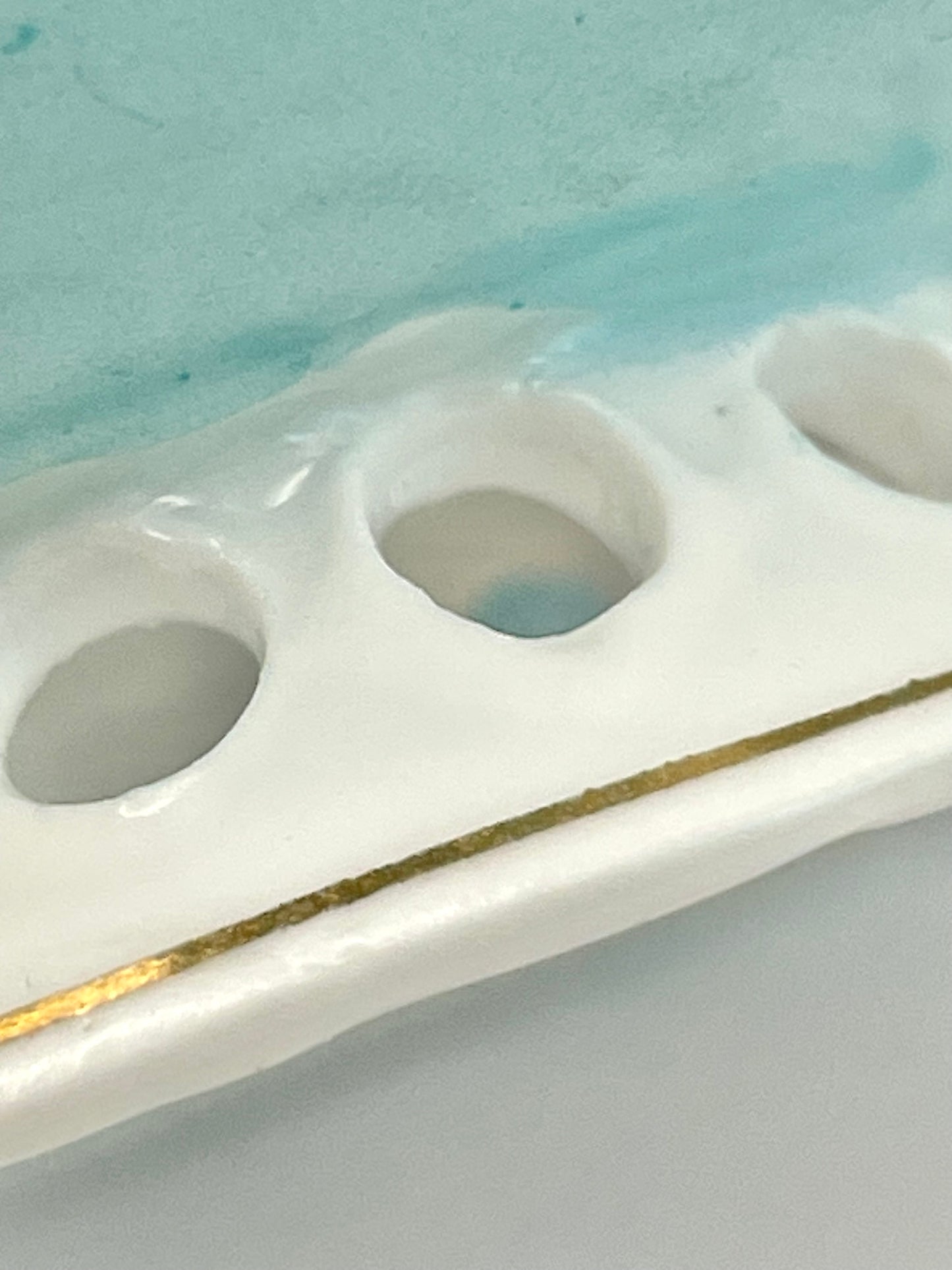 Hand-painted lace-footed porcelain tea cup produced by Kuznetsov