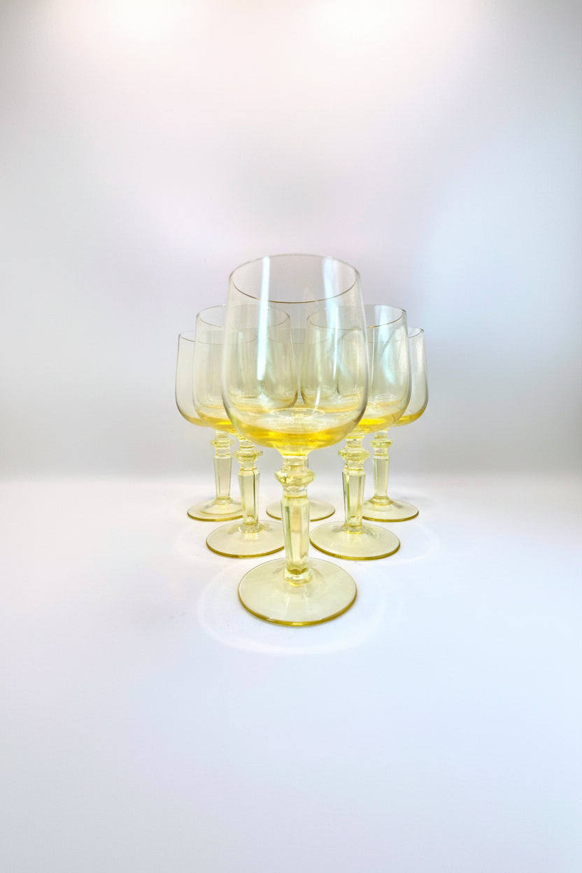 Six yellow wine glasses
