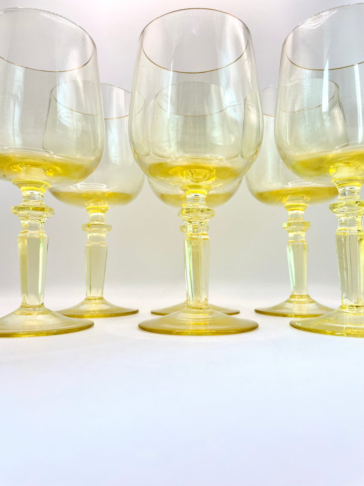 Six yellow wine glasses