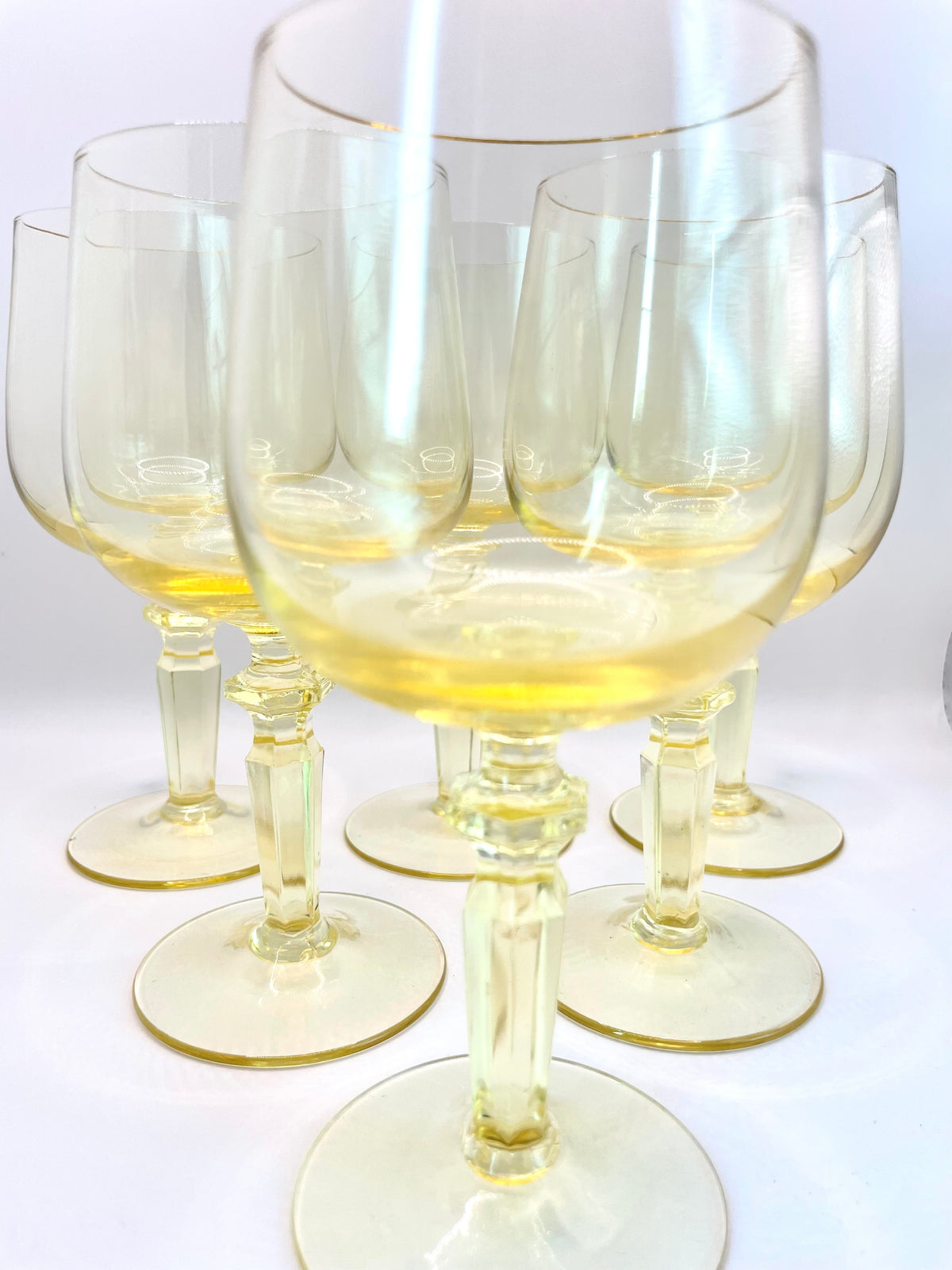 Six yellow wine glasses