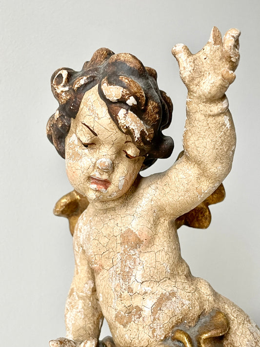 Antique hand-carved wooden cherub figurine